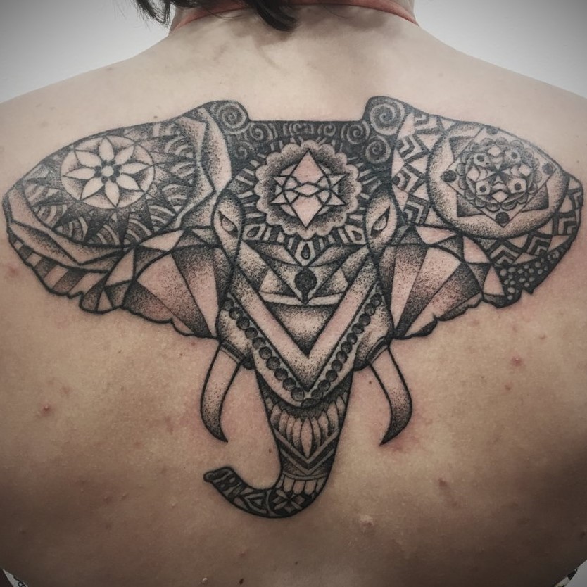 Black and Grey Tattoo by Tattoo Artist Alan Lott of a Mandala Geometric Elephants Head on the upper back. Created at Sacred Mandala Studio in Durham, North Carolina. Home of Custom Tattoos and Art Gallery in the Triangle - Raleigh, Durham and Chapel Hill, NC