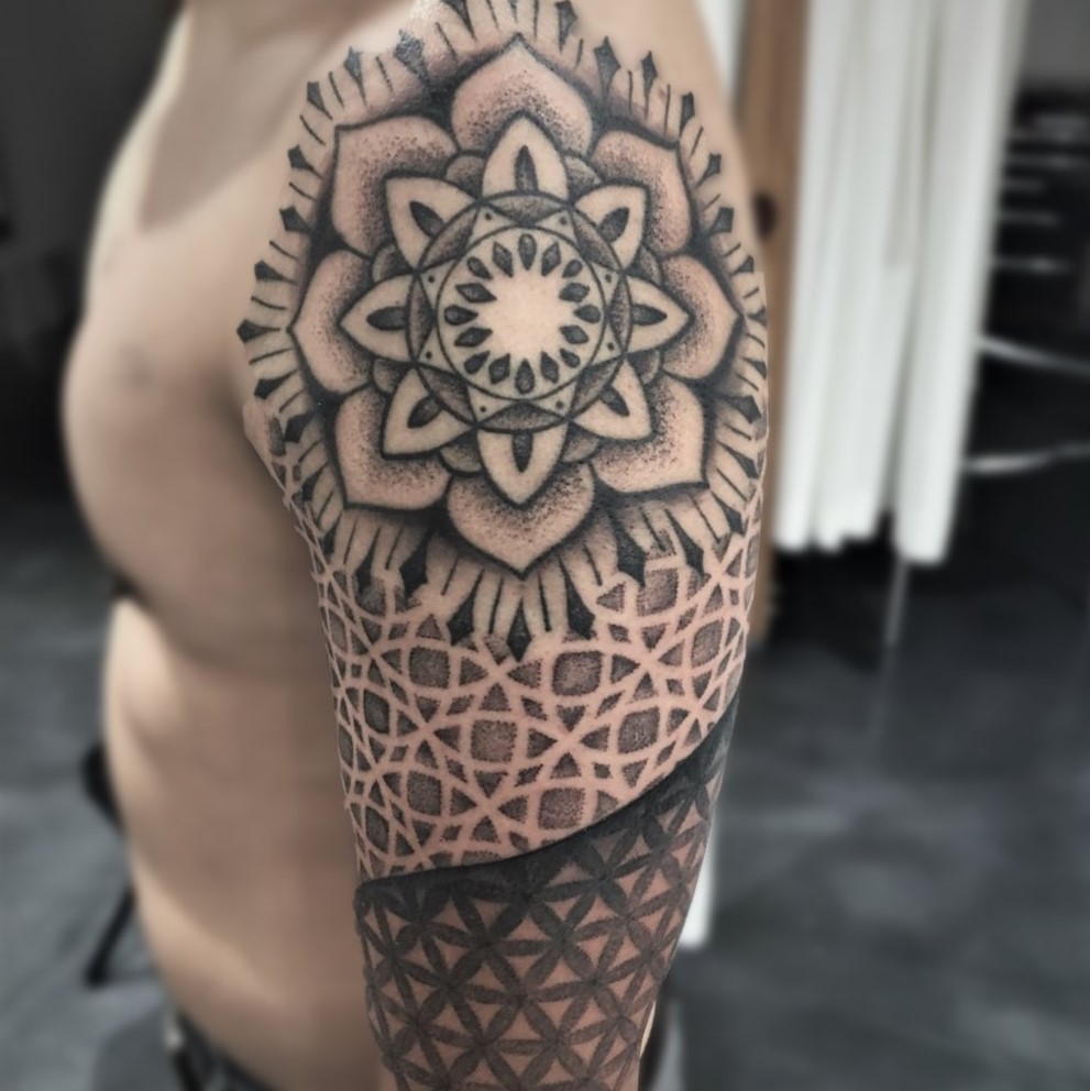 Mandala arm sleeve tattoo done in black and grey by tattoo artist Alan Lott at Sacred Mandala Studio in Durham, NC.