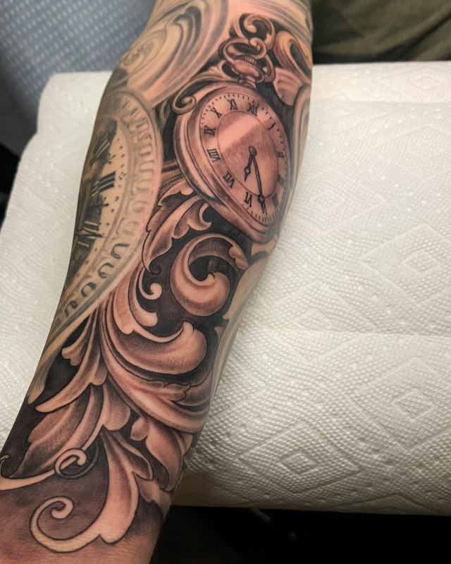 Black and grey fine line pocket watch forearm tattoo  by Shaine Smith of Sacred Mandala Studio.