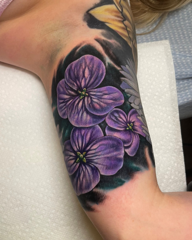 Purple Anemone forearm tattoo by Shaine Smith of Sacred Mandala Studio.