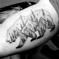 Mountain and Trees in a Bear Outline tattoo created by Ray Durham of Sacred Mandala Studio in Durham, NC.
