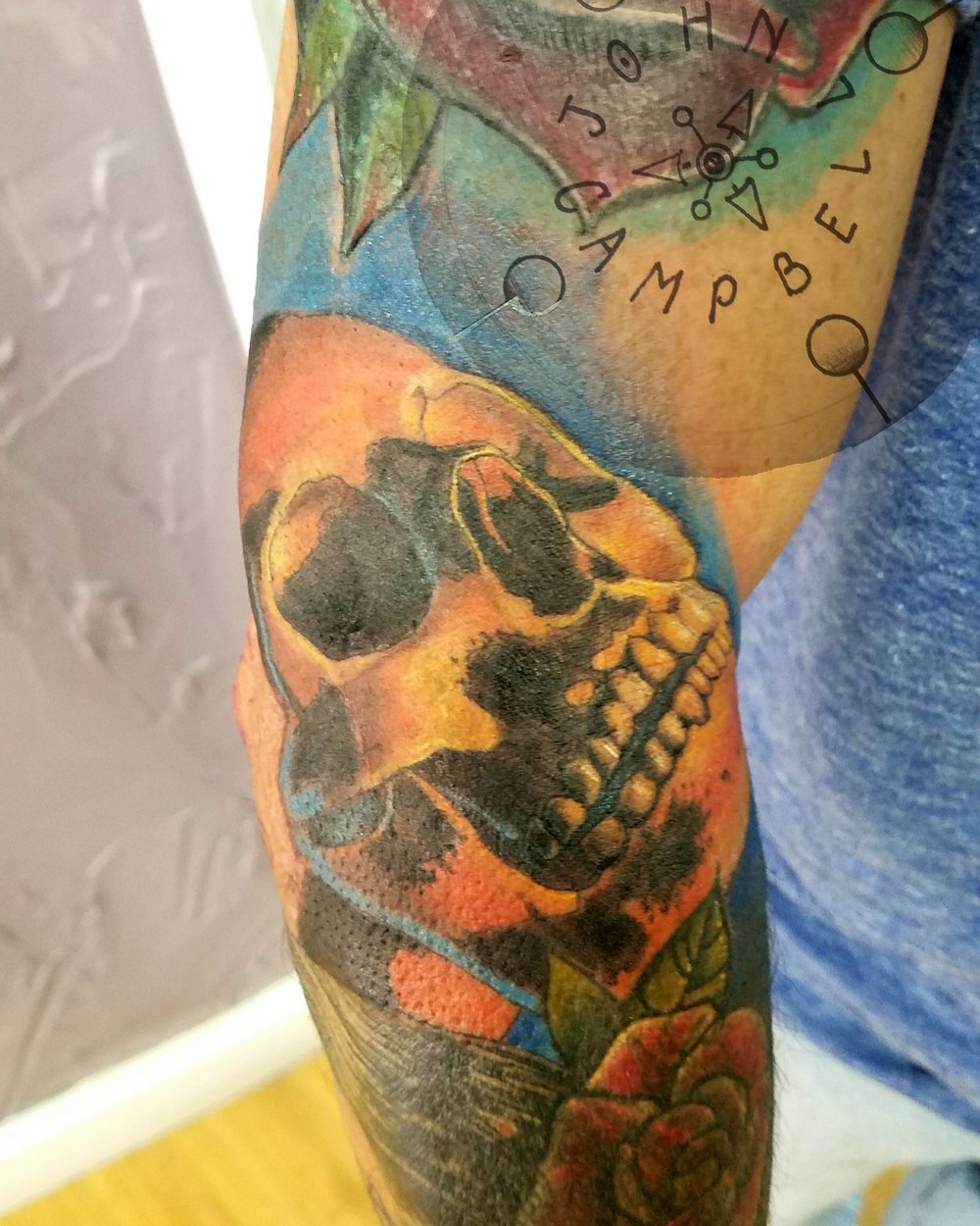 Color Skull Tattoo done by Tattoo Artist John Campbell at Sacred Mandala Studio - Premium Custom Tattoos and Art Gallery in the Triangle - Raleigh, Durham and Chapel Hill, NC.