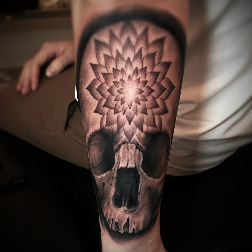 Black and Grey Skull Tattoo with a Mandala on the Skulls Forehead, created by Tattoo Artist Alan Lott at Sacred Mandala Studio in Durham, NC.