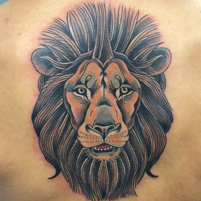 Color tattoo of a lion head created by tattoo artist Jerry Martin II at Sacred Mandala Studio in Durham, NC.