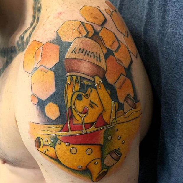 Sacred Mandala Studio's Alan Lott created this colored cartoon half sleeve of Winnie the Pooh. Book a custom tattoo with Alan at Sacred Mandala Studio - Durham, NC.