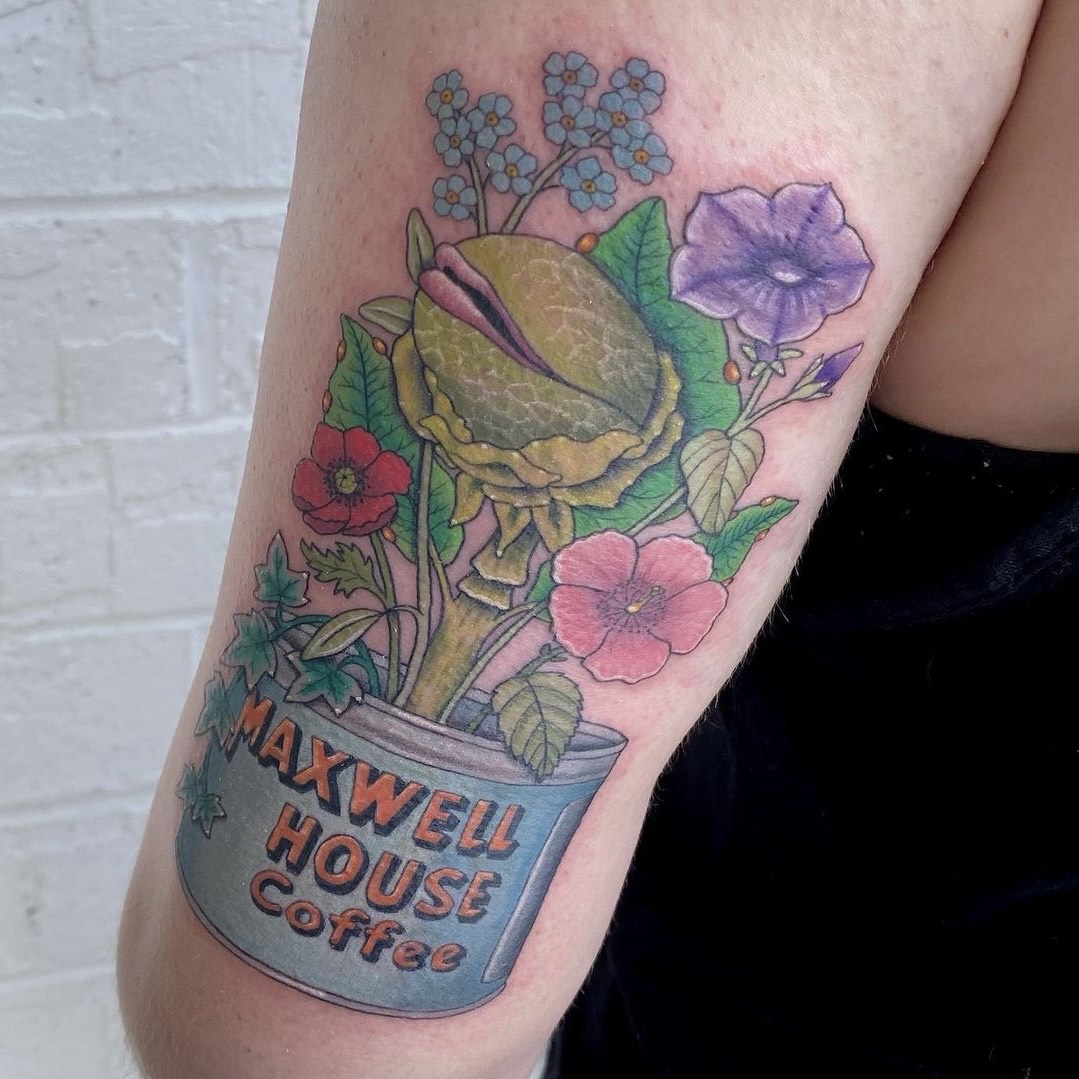 Full color tattoo of plants growing from a tin of maxwell house coffee tattooed by Sarah Cherney of Sacred Mandala Studio.